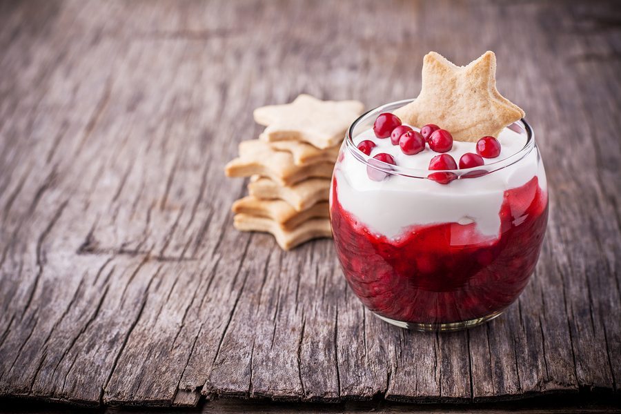 Dessert with cranberry sauce and sour cream decorated gingerbrea